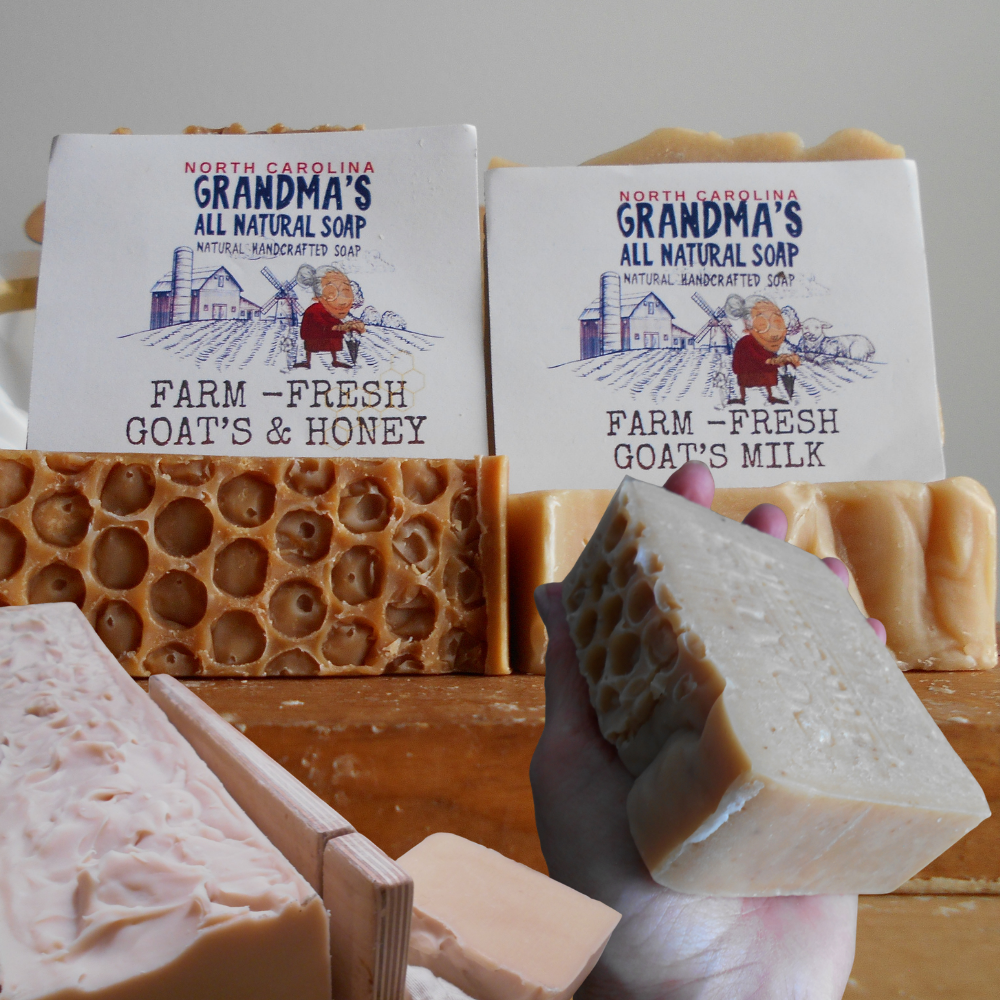 Various bars of soap with 'Grandma's All Natural Soap' packaging on a wooden surface.