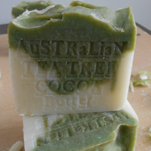 Two green bars of soap with 'Australian Leather' branding on a wooden surface.