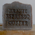 Bar of soap with 'Brazil Espresso Coffee' text on a wooden surface