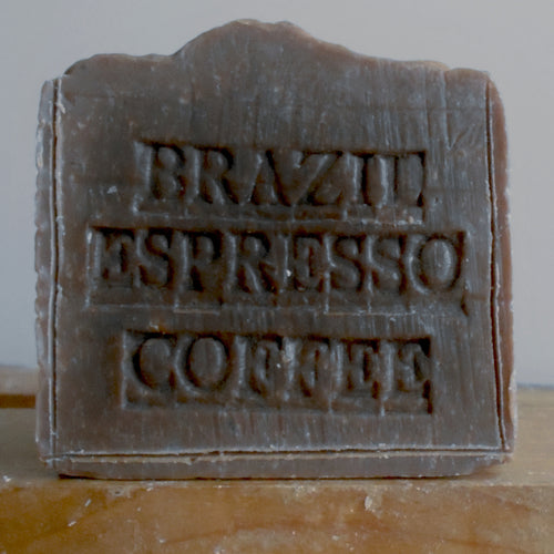 Bar of soap with 'Brazil Espresso Coffee' text on a wooden surface
