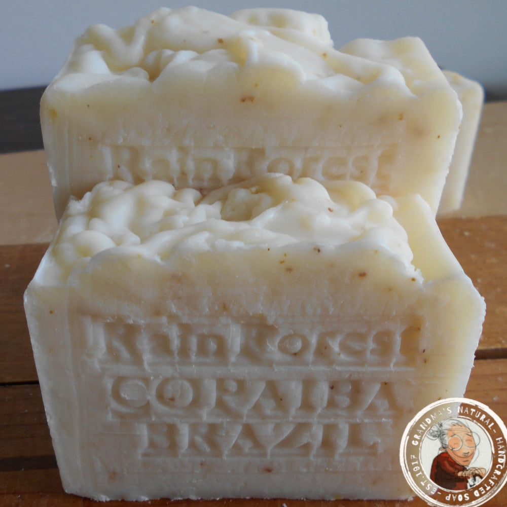 Bath & Body Copaiba Rainforest Brazil branding on a wooden surface.