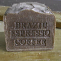 Bar of soap with 'Brazilian Espresso Coffee' text on a wooden surface
