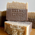 Bar of Guinness Extra Stout soap on a wooden surface