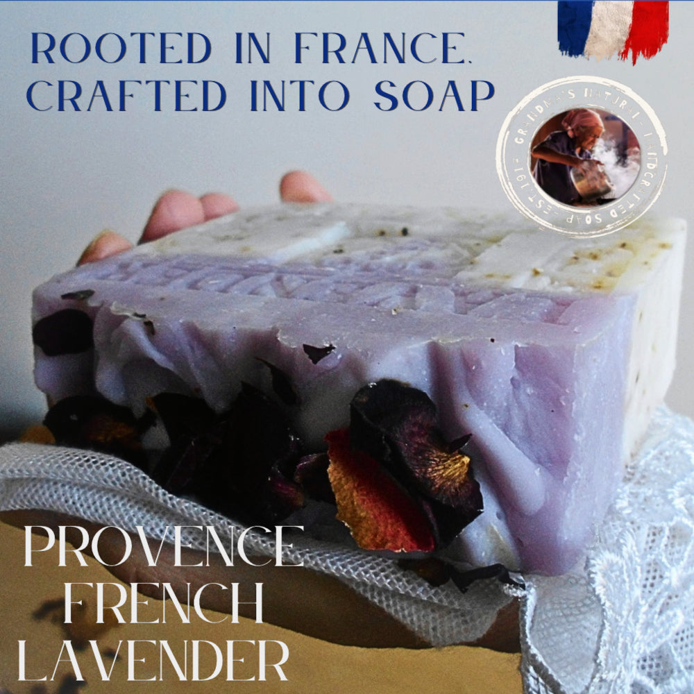 A hand holds a rectangular bar of lavender soap with visible botanical inclusions, set against a neutral background with promotional text reading 'Rooted in France, Crafted into Soap' and 'Provence French Lavender.'. color of provence 827191