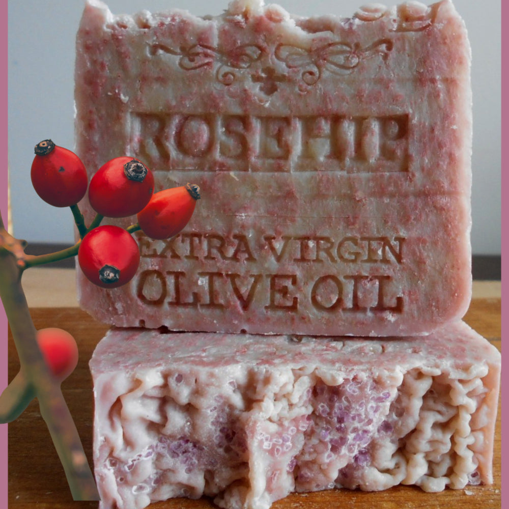 Bars of olive oil with a rosehip plant