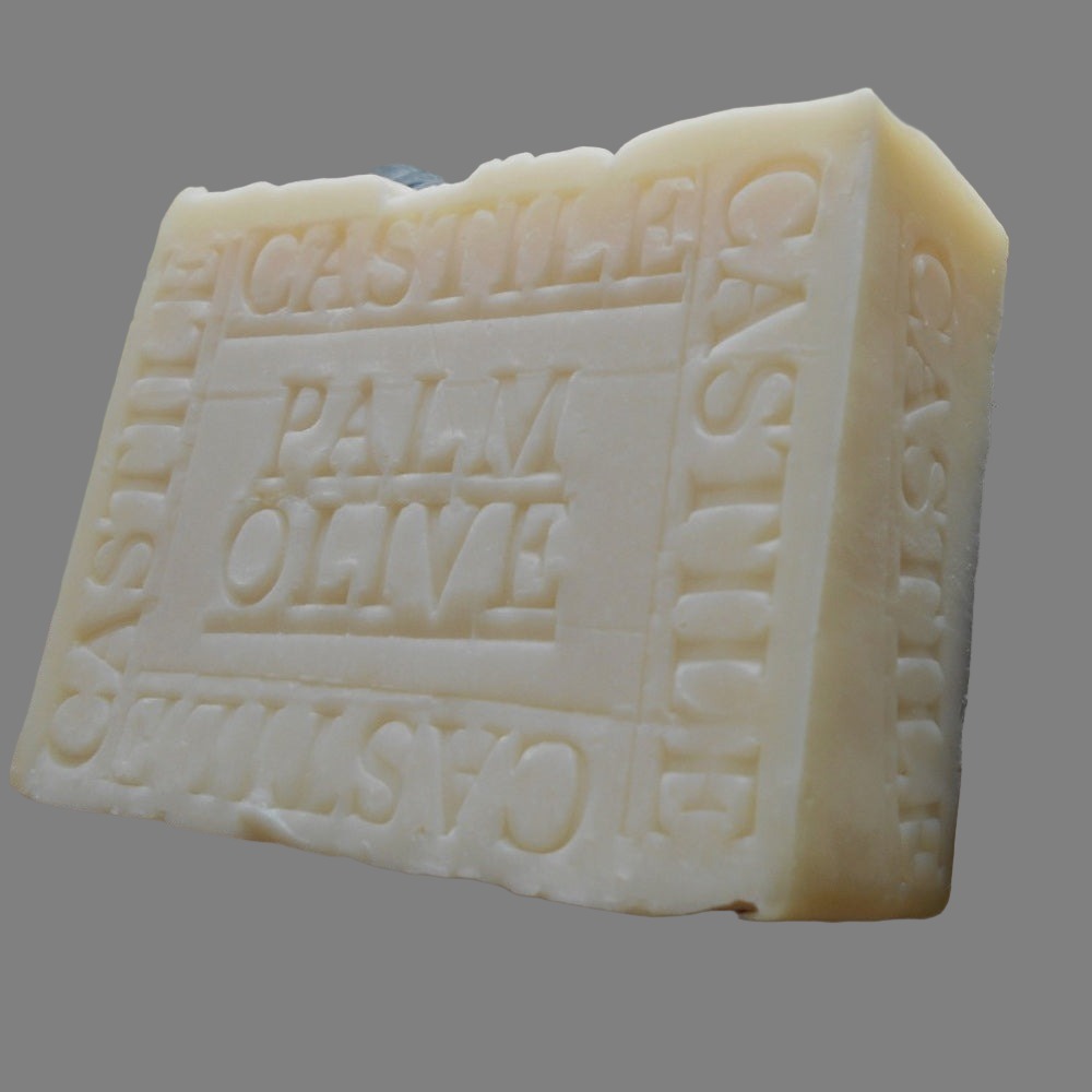 The soap has "CASTILE" embossed on its side, indicating its ingredients sourced from Spanish olive oil and Palm oil. The Bar is white and have an artisanal appearance